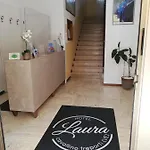 Laura *